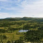With Panoramic Views Over The Mountains